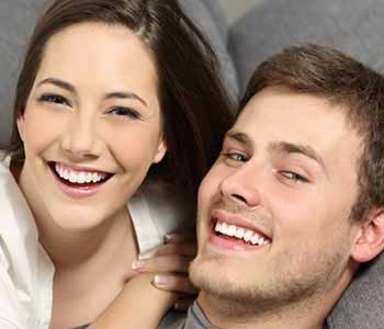 Image of a Happy couple smilling with showing thir brighter teeth