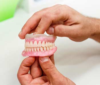 Remedies for Pain from Wearing Dentures in Wichita area