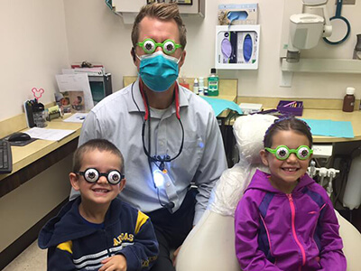 Dr. David Koepsel and kids doing thier dental treatments