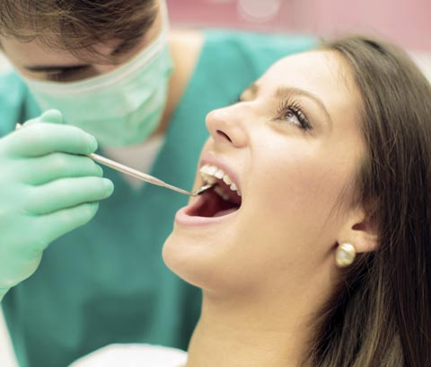 Invisalign Dentist Wichita KS - Woman at dental having treatment